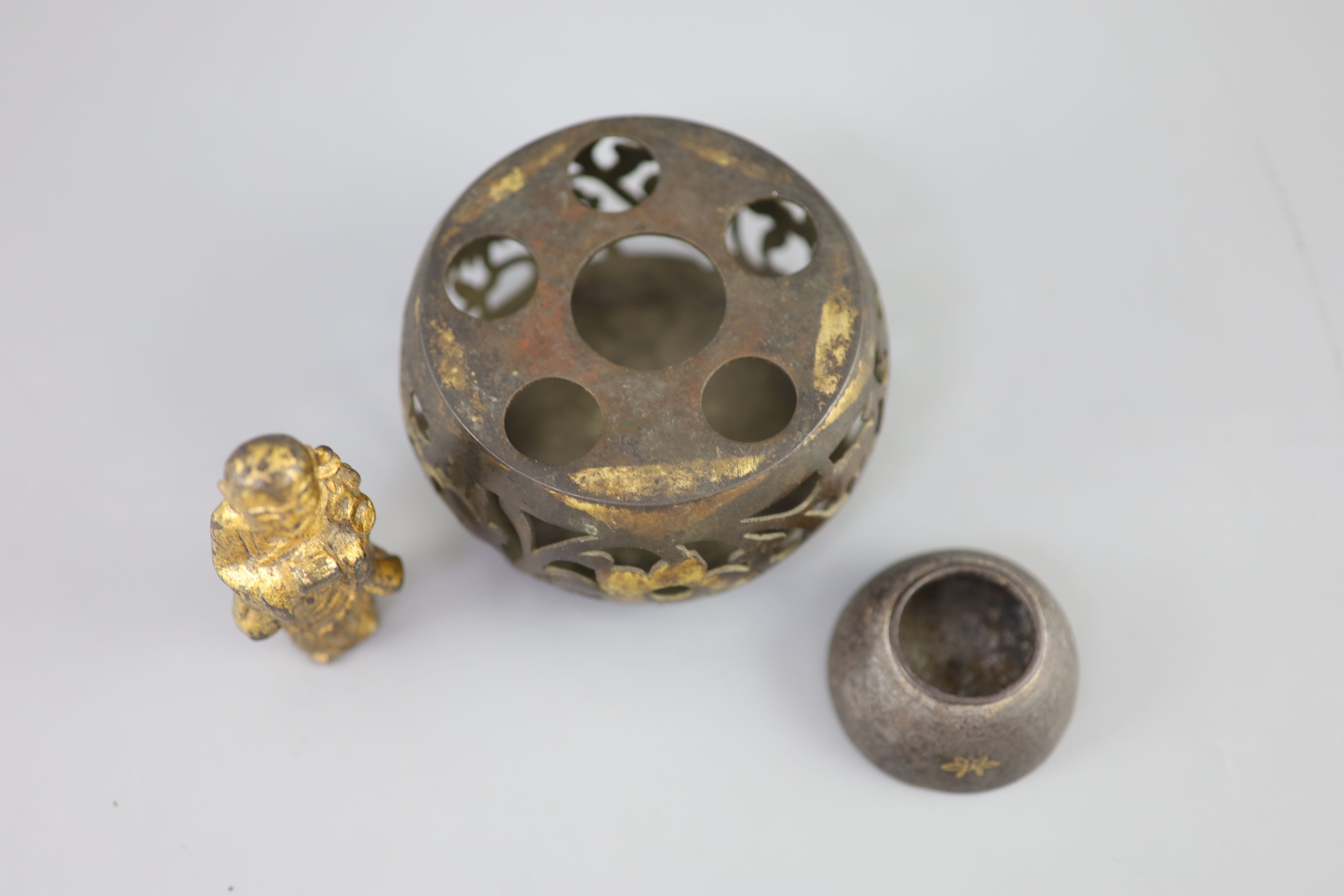 A Chinese bronze drum-shaped stand, a gilt bronze figure of a monk, 17th/18th century and a silver and gold inlaid iron waterpot, Qing,